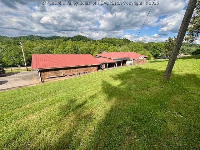 2011 Archibald Dr, Charleston, WV 25320 - view of green lawn featuring a forest view