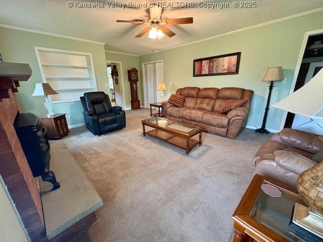 2011 Archibald Dr, Charleston, WV 25320 - carpeted living area featuring crown molding, a ceiling fan, a textured ceiling, built in features, and baseboards