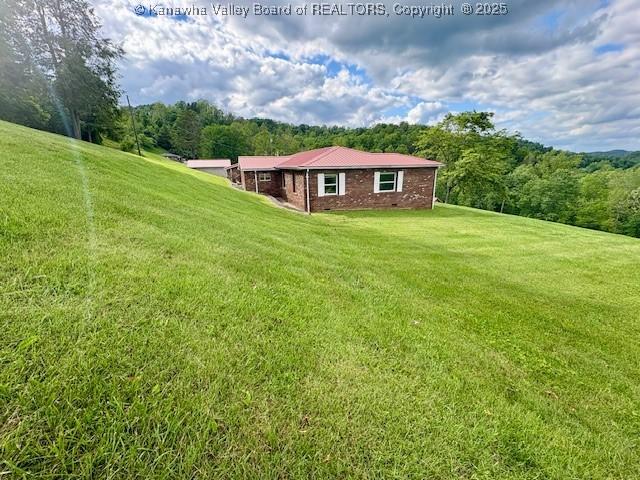 2011 Archibald Dr, Charleston, WV 25320 - view of grassy yard featuring a wooded view