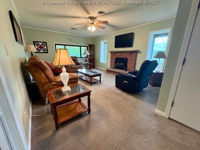 2011 Archibald Dr, Charleston, WV 25320 - living room featuring crown molding, carpet, a brick fireplace, a textured ceiling, and ceiling fan