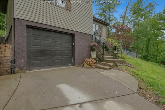 26 Banister Dr, Cross Lanes, WV 25313 - garage featuring concrete driveway