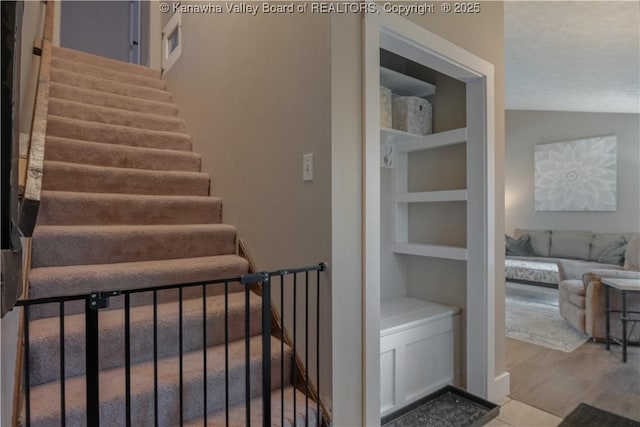 26 Banister Dr, Cross Lanes, WV 25313 - staircase with built in features and wood finished floors