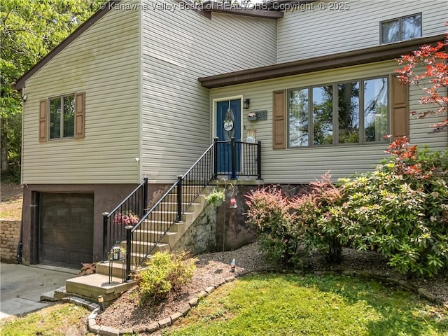 26 Banister Dr, Cross Lanes, WV 25313 - view of front facade with a garage and driveway
