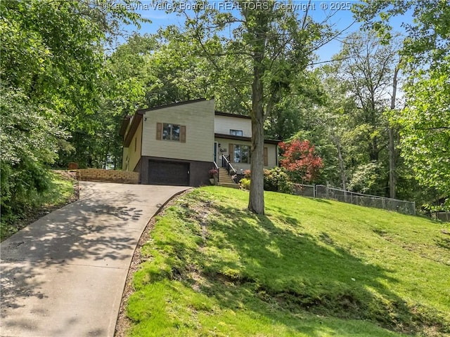 26 Banister Dr, Cross Lanes, WV 25313 - view of front of home featuring driveway and a garage