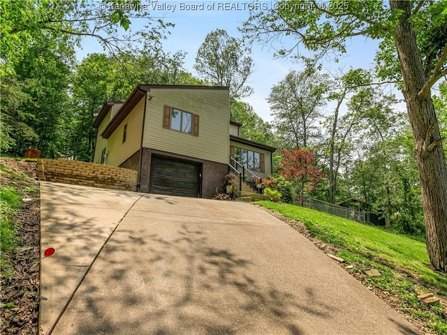 26 Banister Dr, Cross Lanes, WV 25313 - view of front of home featuring an attached garage and driveway