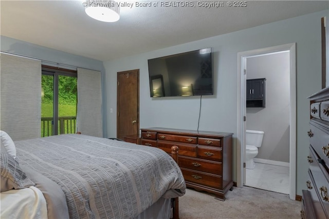 26 Banister Dr, Cross Lanes, WV 25313 - bedroom with access to outside, ensuite bath, light colored carpet, and baseboards