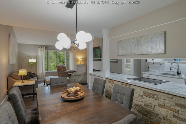 26 Banister Dr, Cross Lanes, WV 25313 - dining space with a chandelier and wood finished floors