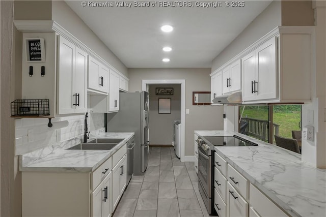 26 Banister Dr, Cross Lanes, WV 25313 - kitchen featuring stainless steel appliances, a sink, under cabinet range hood, light marble finish floors, and white cabinets
