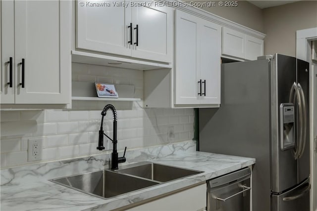 26 Banister Dr, Cross Lanes, WV 25313 - kitchen with a sink, stainless steel appliances, white cabinetry, and backsplash