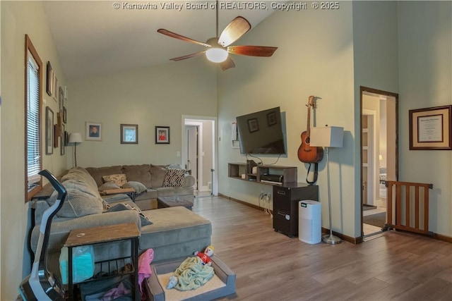 26 Banister Dr, Cross Lanes, WV 25313 - living area featuring high vaulted ceiling, wood finished floors, a ceiling fan, and baseboards