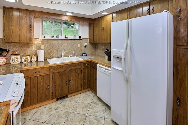 205 Autumn Dr, Dunbar, WV 25064 - kitchen with white appliances, a sink, brown cabinets, backsplash, and recessed lighting