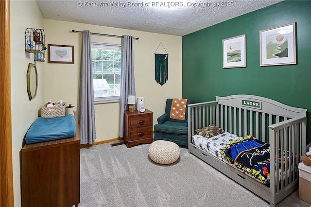 205 Autumn Dr, Dunbar, WV 25064 - carpeted bedroom with a textured ceiling and a nursery area