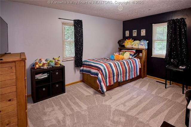 205 Autumn Dr, Dunbar, WV 25064 - carpeted bedroom featuring a textured ceiling and baseboards