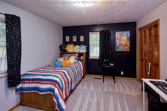 205 Autumn Dr, Dunbar, WV 25064 - bedroom featuring multiple windows, carpet, a textured ceiling, and baseboards