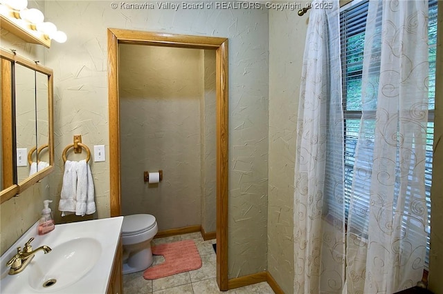 205 Autumn Dr, Dunbar, WV 25064 - bathroom featuring toilet, tile patterned flooring, vanity, and a textured wall