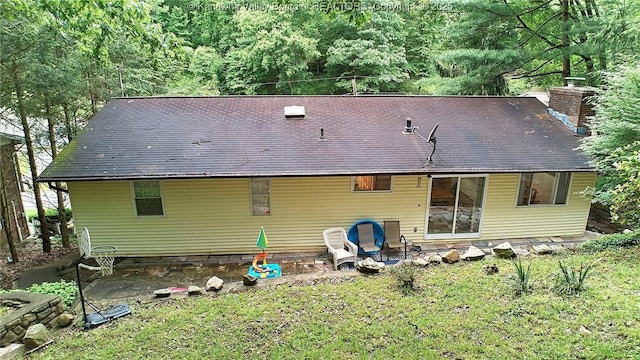 205 Autumn Dr, Dunbar, WV 25064 - rear view of property with a chimney, a lawn, and a wooded view