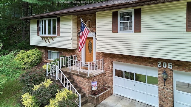 205 Autumn Dr, Dunbar, WV 25064 - split foyer home featuring brick siding and a garage