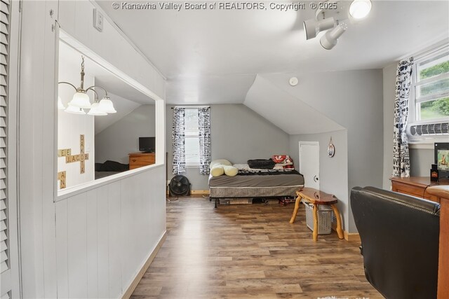 223 Easter Rd, Nitro, WV 25143 - bedroom with wood finished floors, a chandelier, and lofted ceiling