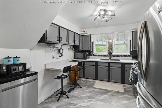 223 Easter Rd, Nitro, WV 25143 - kitchen featuring appliances with stainless steel finishes, a sink, gray cabinets, and light countertops