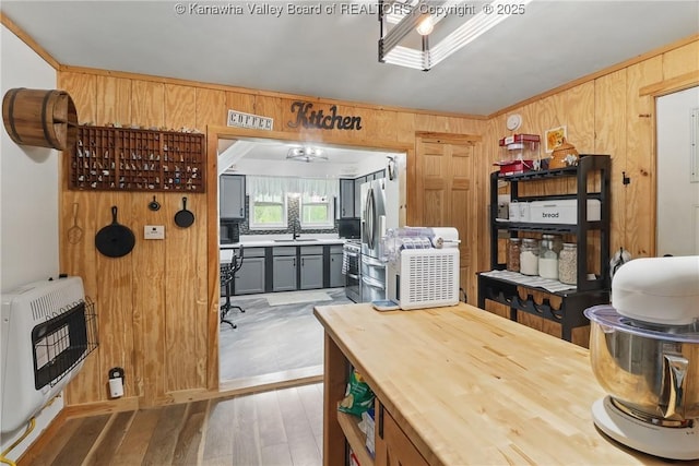 223 Easter Rd, Nitro, WV 25143 - dining area with heating unit, wooden walls, and hardwood / wood-style flooring