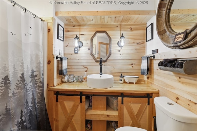 223 Easter Rd, Nitro, WV 25143 - bathroom featuring wooden ceiling, wood walls, toilet, a shower with curtain, and vanity