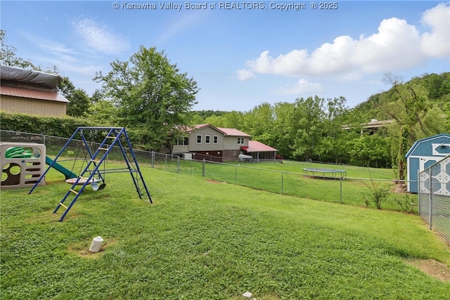 223 Easter Rd, Nitro, WV 25143 - view of yard with a trampoline and a playground