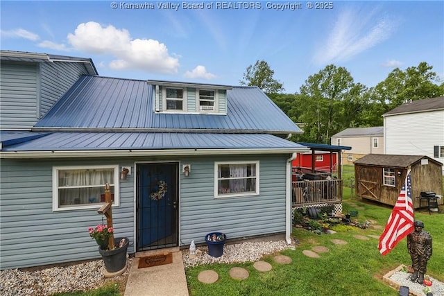 223 Easter Rd, Nitro, WV 25143 - view of front of house featuring a front yard and metal roof