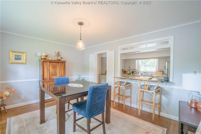 1418 Sweetbrier Rd, Charleston, WV 25314 - dining space with ornamental molding and light wood finished floors