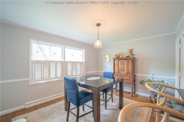 1418 Sweetbrier Rd, Charleston, WV 25314 - dining room featuring a baseboard heating unit, crown molding, plenty of natural light, light wood-style flooring, and baseboards