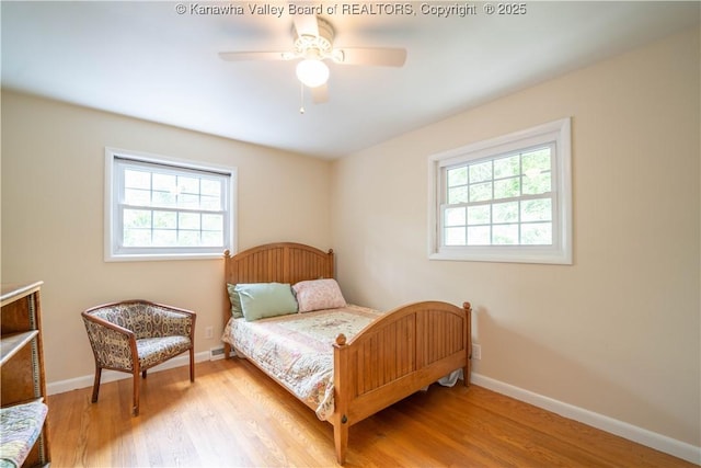 1418 Sweetbrier Rd, Charleston, WV 25314 - bedroom featuring multiple windows, wood finished floors, and baseboards