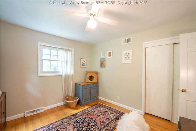 1418 Sweetbrier Rd, Charleston, WV 25314 - bedroom featuring light wood-style flooring, a closet, baseboards, and ceiling fan