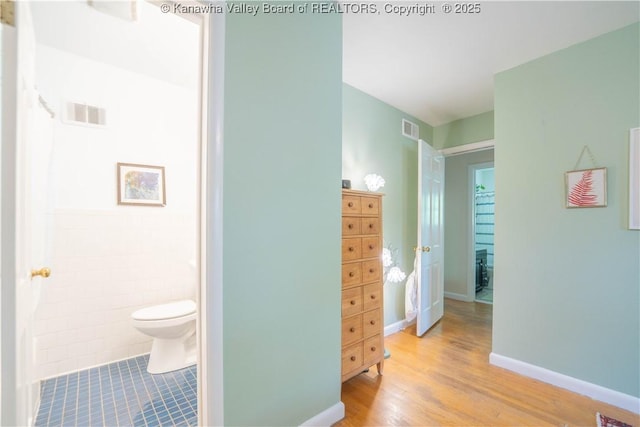 1418 Sweetbrier Rd, Charleston, WV 25314 - bathroom featuring toilet, wood finished floors, and baseboards