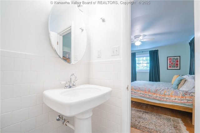 1418 Sweetbrier Rd, Charleston, WV 25314 - ensuite bathroom featuring tile walls, wood finished floors, a ceiling fan, and wainscoting