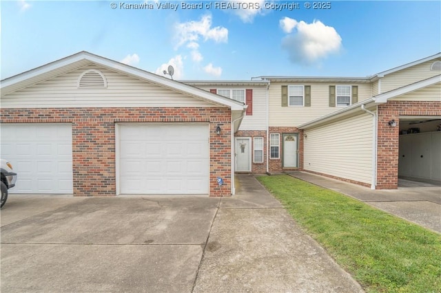 911 4th Ave, Saint Albans, WV 25177 - view of property with brick siding, concrete driveway, and an attached garage
