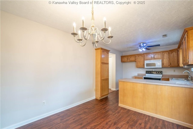 911 4th Ave, Saint Albans, WV 25177 - kitchen featuring white microwave, electric range oven, a sink, a chandelier, and baseboards