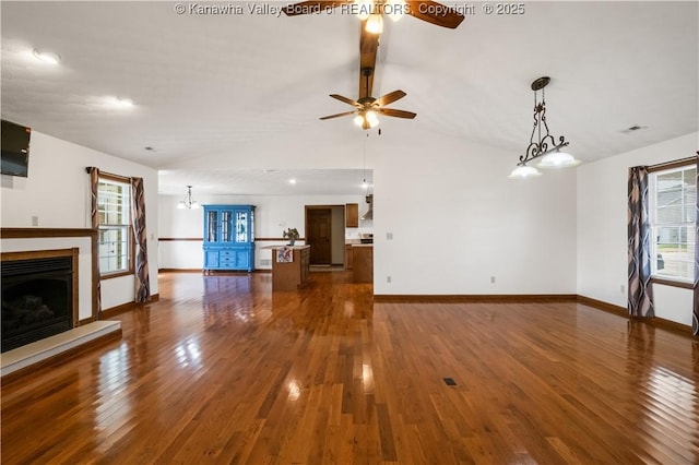 213 Rumer Sta, Red House, WV 25168 - unfurnished living room featuring ceiling fan, wood finished floors, baseboards, and a fireplace with raised hearth