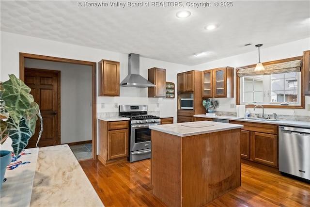 213 Rumer Sta, Red House, WV 25168 - kitchen featuring wall chimney exhaust hood, stainless steel appliances, a sink, light countertops, and dark wood finished floors