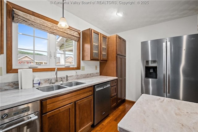 213 Rumer Sta, Red House, WV 25168 - kitchen featuring appliances with stainless steel finishes, a sink, dark wood-type flooring, glass insert cabinets, and hanging light fixtures