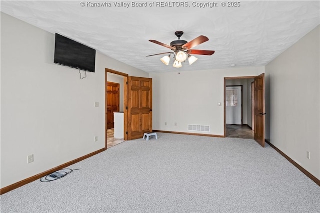 213 Rumer Sta, Red House, WV 25168 - unfurnished living room with baseboards, light colored carpet, and ceiling fan