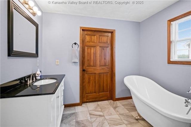 213 Rumer Sta, Red House, WV 25168 - full bath featuring vanity, a freestanding tub, baseboards, and marble finish flooring
