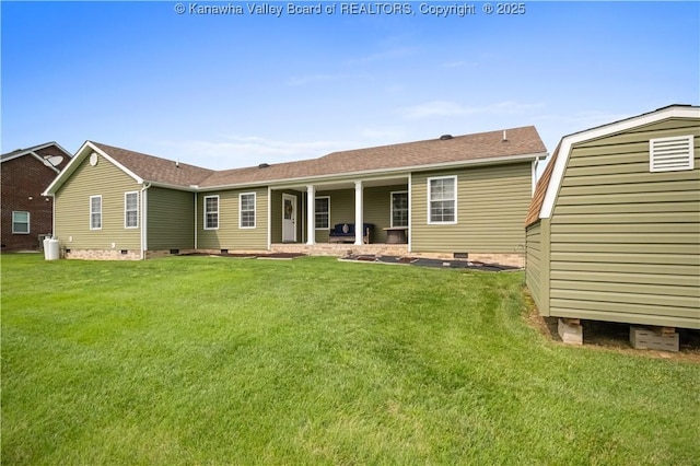 213 Rumer Sta, Red House, WV 25168 - rear view of house featuring crawl space, a lawn, a shingled roof, and an outbuilding