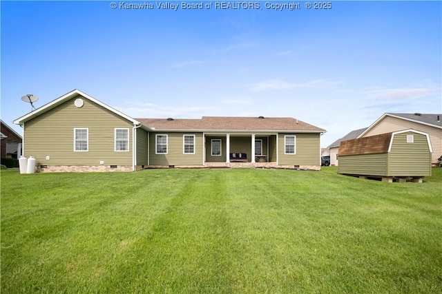 213 Rumer Sta, Red House, WV 25168 - back of property with crawl space and a lawn