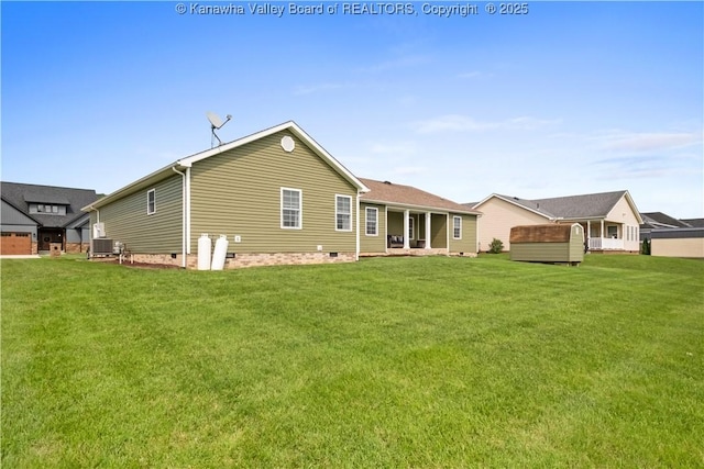 213 Rumer Sta, Red House, WV 25168 - back of property with crawl space, a lawn, and cooling unit