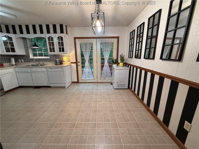 211 Geronimo Dr, Saint Albans, WV 25177 - kitchen featuring white dishwasher, a sink, white cabinets, and glass insert cabinets