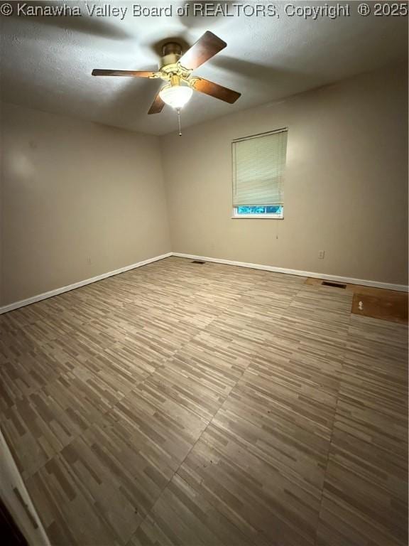 211 Geronimo Dr, Saint Albans, WV 25177 - unfurnished room featuring a ceiling fan and baseboards
