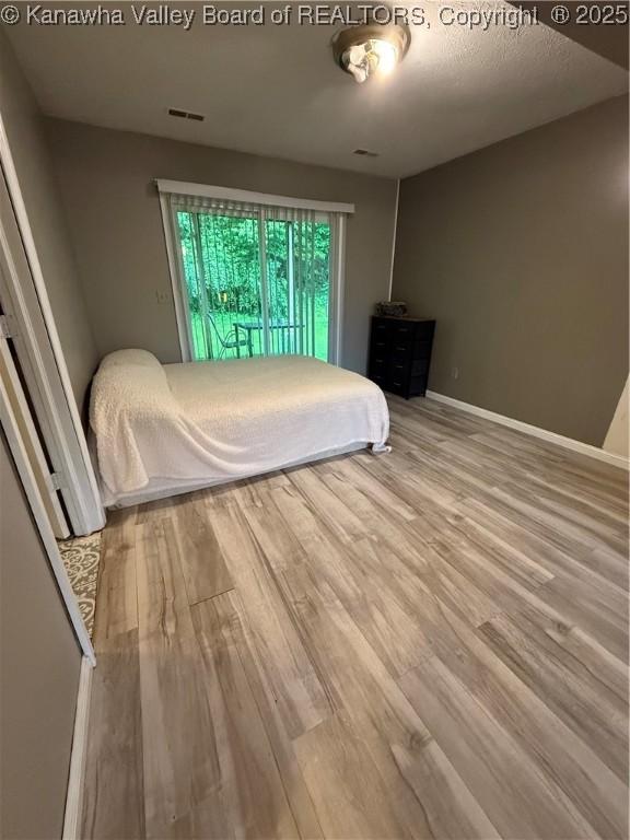 211 Geronimo Dr, Saint Albans, WV 25177 - bedroom with wood finished floors and baseboards
