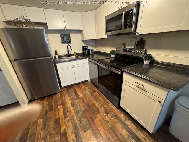 2106 Kanawha Blvd E Unit 322, Charleston, WV 25311 - kitchen with appliances with stainless steel finishes, white cabinetry, dark countertops, and dark wood-type flooring