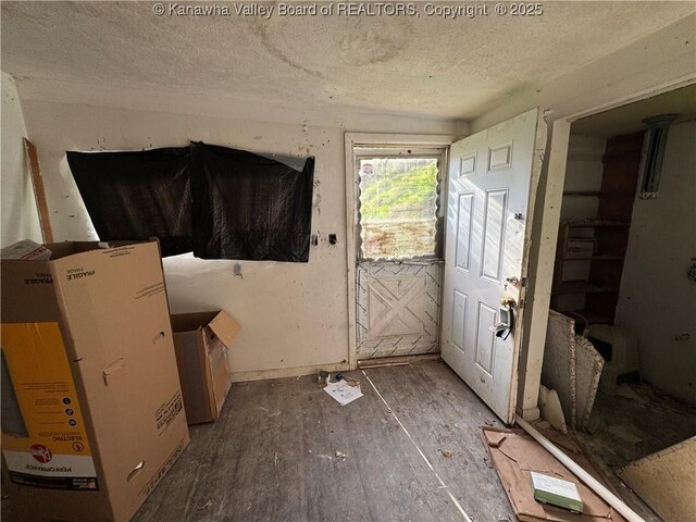 3211 Georges Dr, Saint Albans, WV 25177 - entryway featuring a textured ceiling and wood finished floors