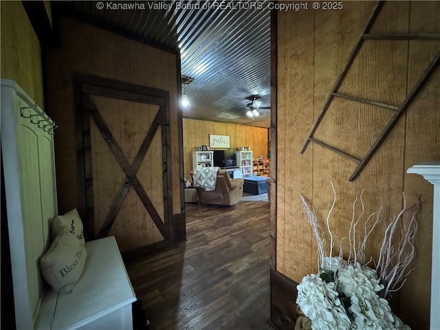 3902 Poca River Rd S, Poca, WV 25159 - hallway featuring wooden walls and dark wood-style floors