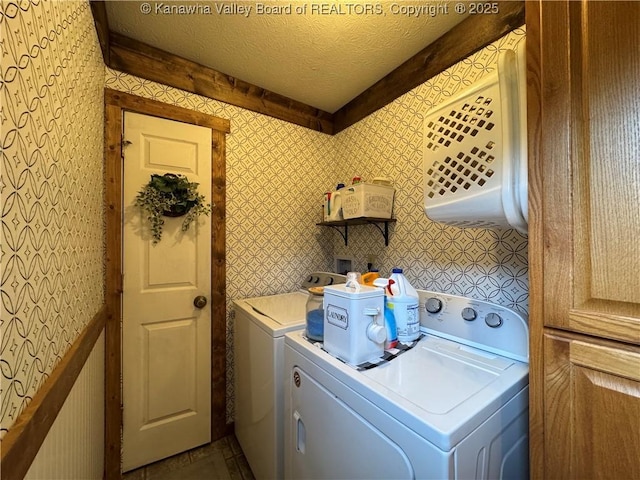 3902 Poca River Rd S, Poca, WV 25159 - laundry area with washing machine and clothes dryer, wallpapered walls, and a textured ceiling